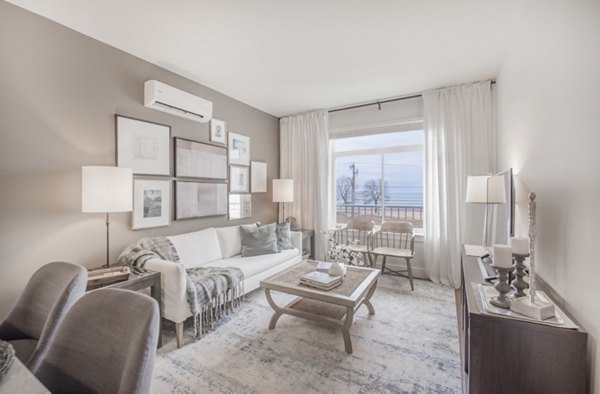 Modern living room with sea views at The Eliot on Ocean Apartments, offering luxury coastal living near  training facilities