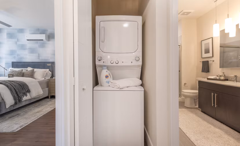 Laundry room with modern appliances at The Eliot on Ocean Apartments