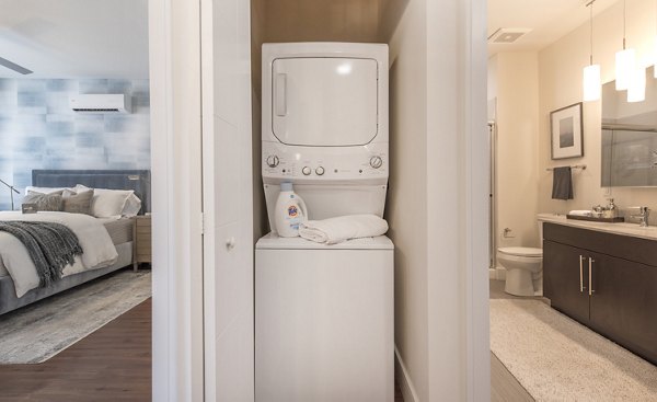 Laundry room with modern appliances at The Eliot on Ocean Apartments