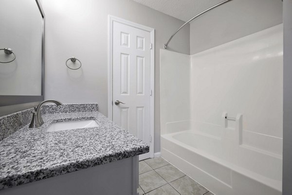 Luxurious bathroom with marble countertops at Regent Place Apartments