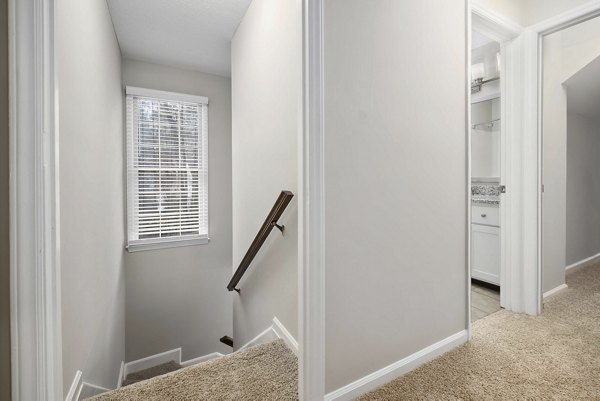 Elegant dining area with modern lighting fixtures in Regent Place Apartments