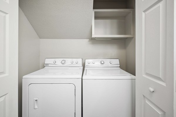 Efficient laundry facilities with modern appliances in Regent Place Apartments, offering convenience for luxury apartment living