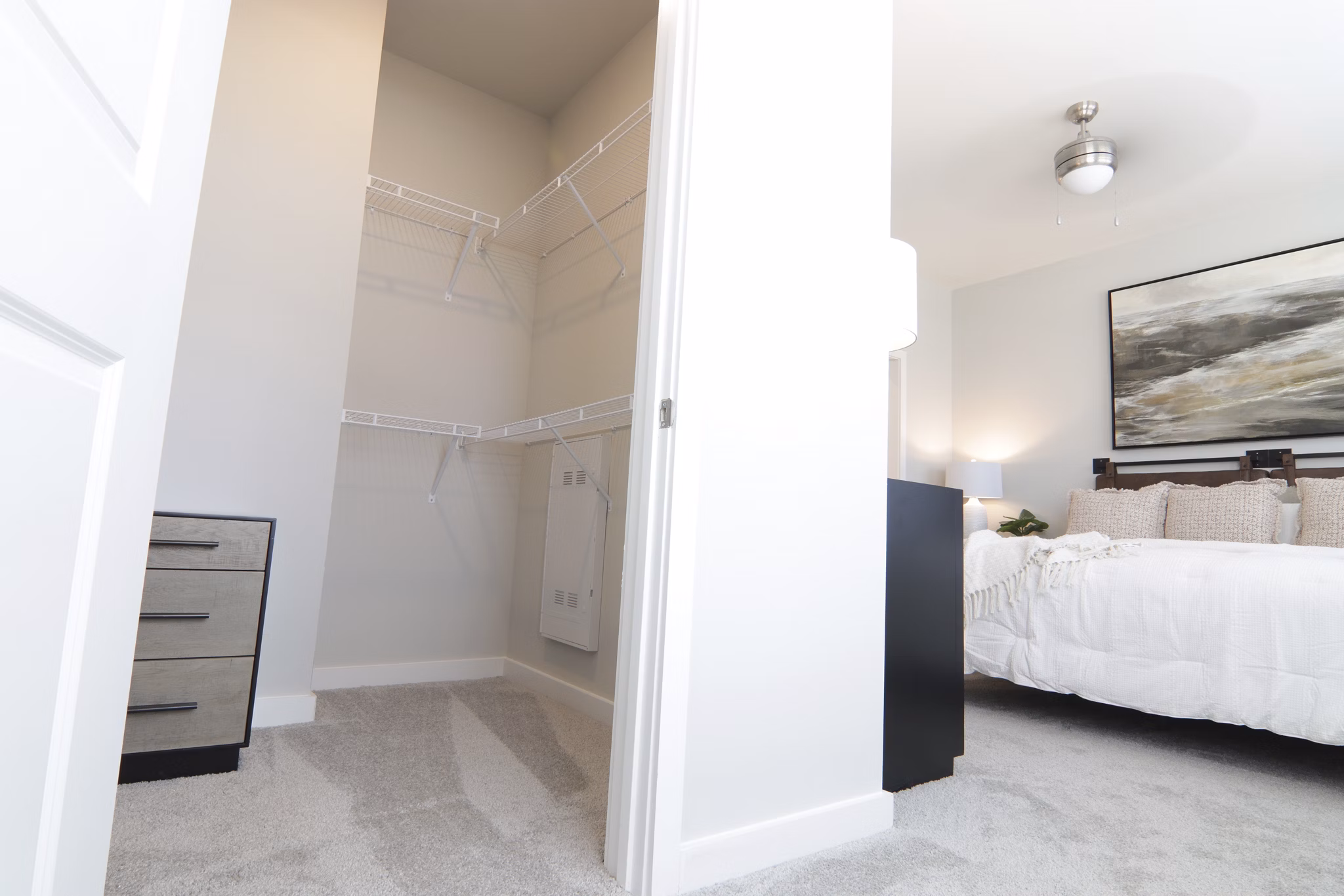 Walk-in closet with custom shelving in The Ravelle at Ridgeview Apartments