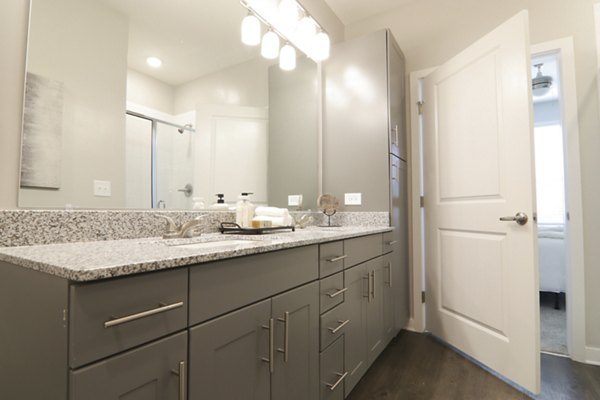 Bright bathroom with modern fixtures in The Ravelle at Ridgeview Apartments