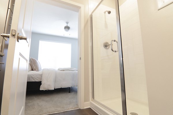 Luxurious bathroom featuring sleek fixtures and elegant design at The Ravelle at Ridgeview Apartments