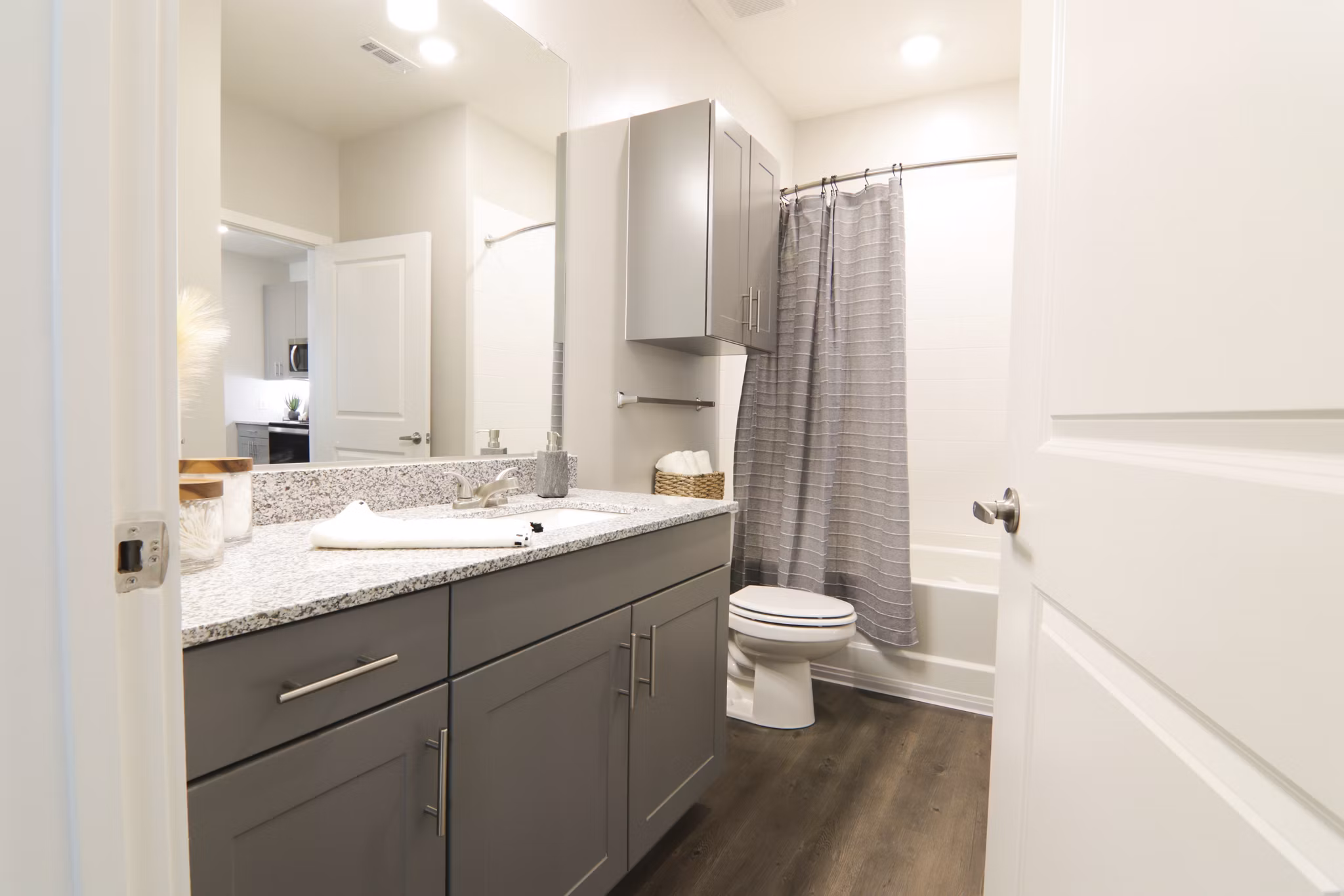Luxury bathroom with modern fixtures and sleek vanity at The Ravelle at Ridgeview Apartments