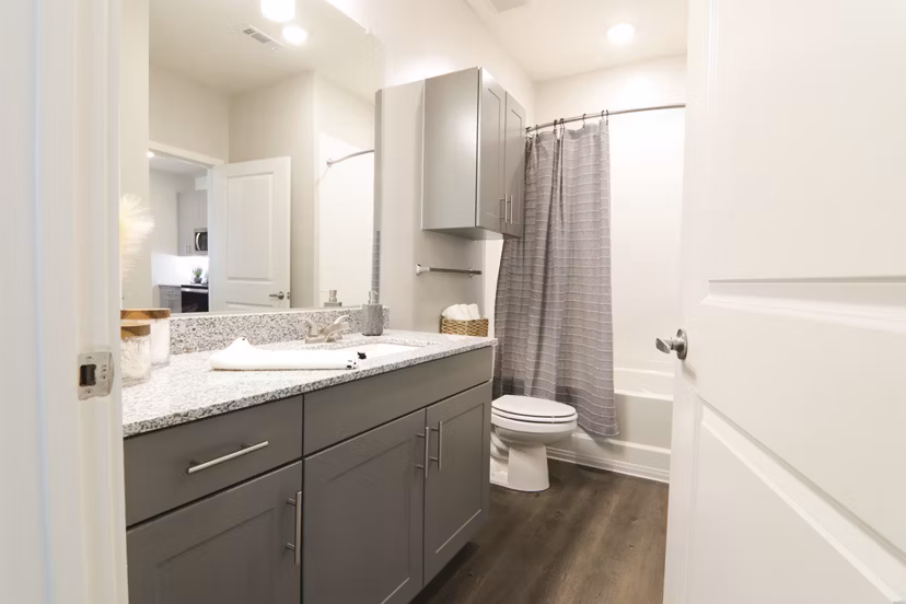 Luxury bathroom with modern fixtures and sleek vanity at The Ravelle at Ridgeview Apartments