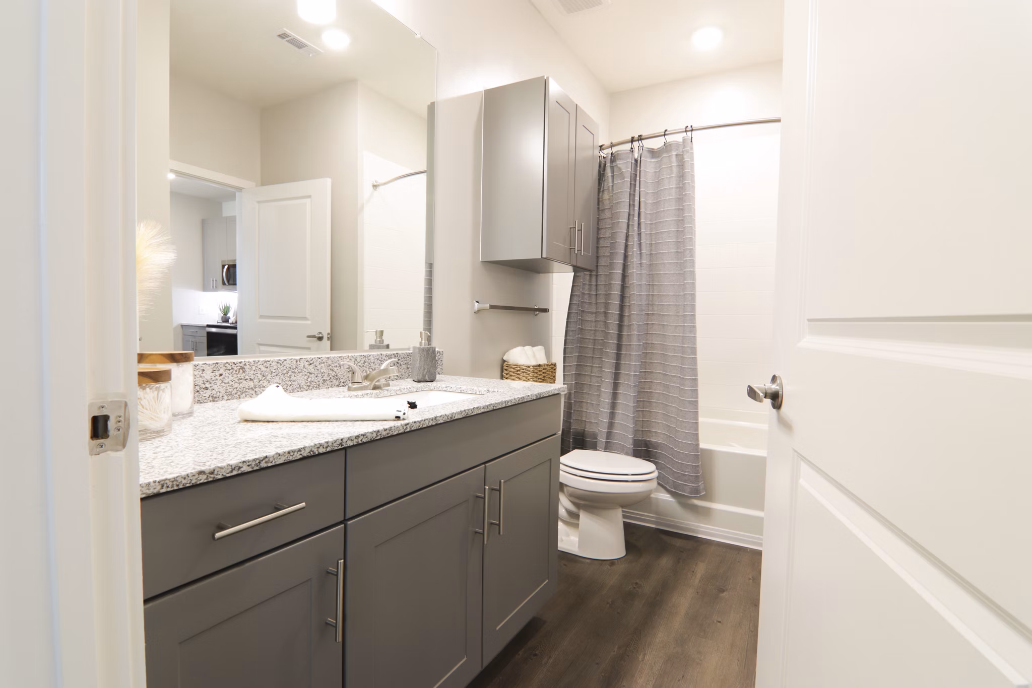 Luxury bathroom with modern fixtures and sleek vanity at The Ravelle at Ridgeview Apartments
