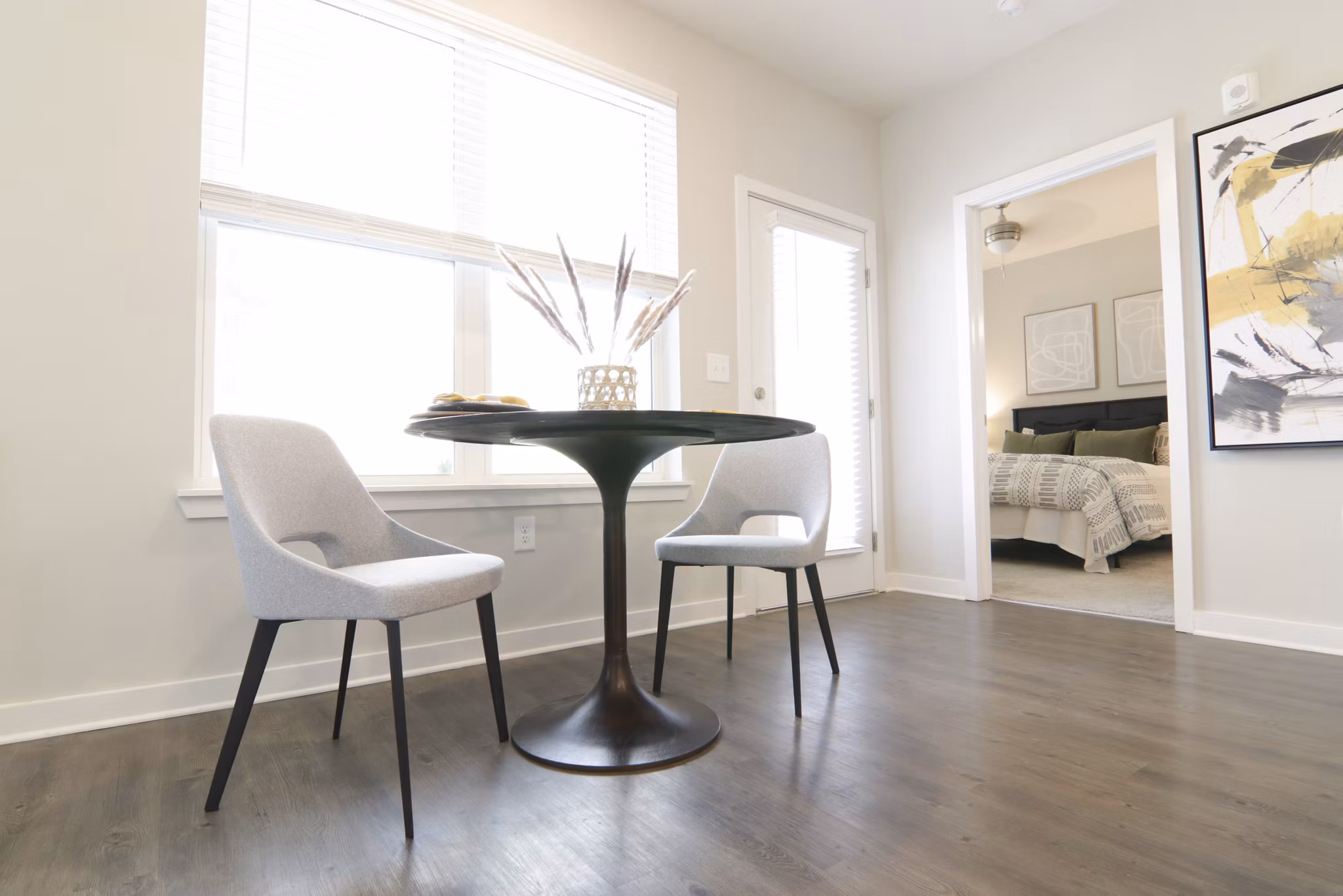 Dining area with elegant lighting and modern decor at The Ravelle at Ridgeview Apartments, luxury living with style and comfort