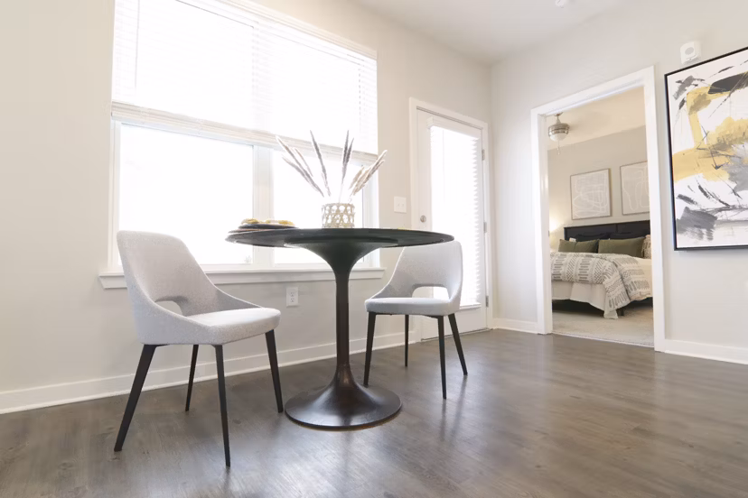 Dining area with elegant lighting and modern decor at The Ravelle at Ridgeview Apartments, luxury living with style and comfort