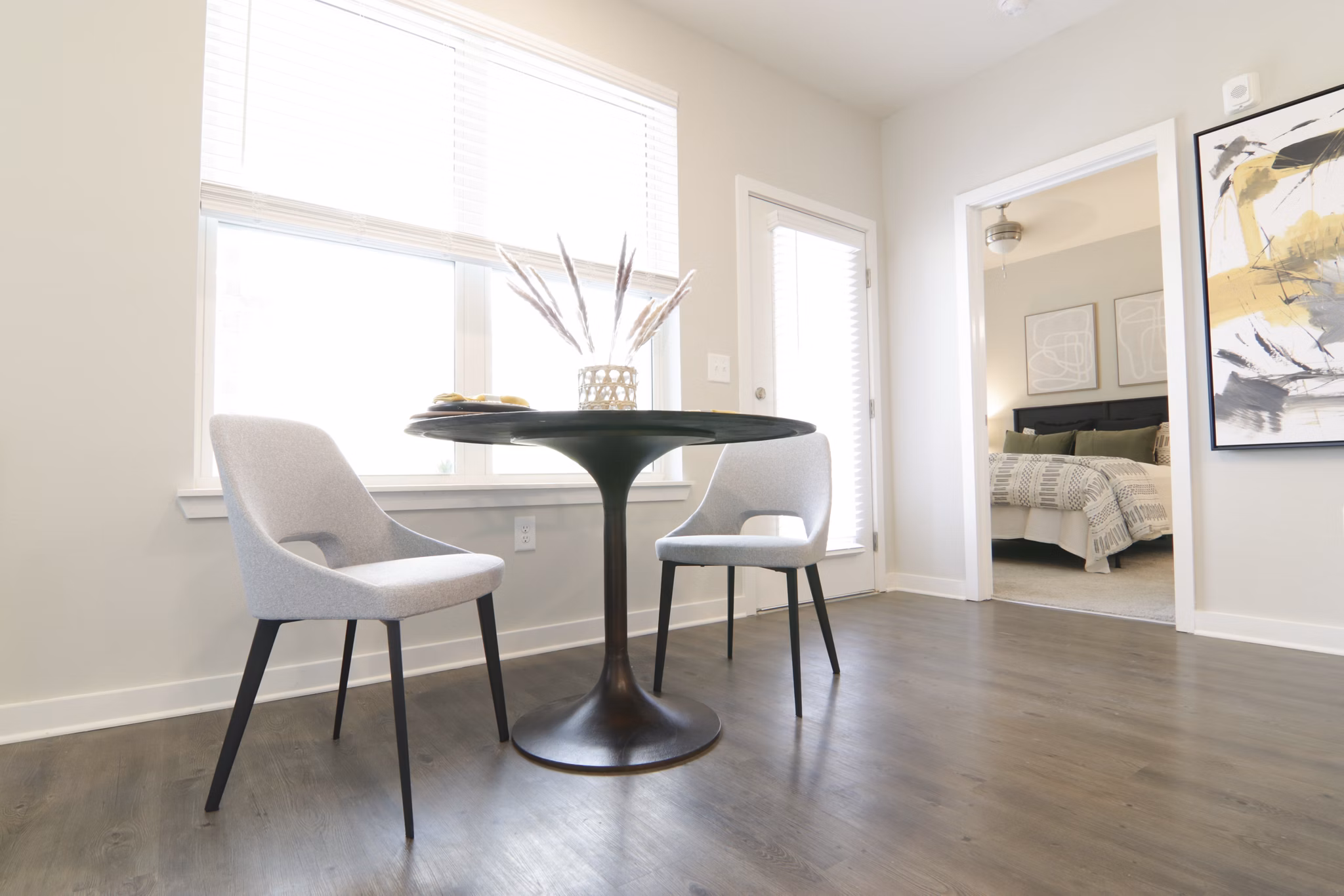 Dining area with elegant lighting and modern decor at The Ravelle at Ridgeview Apartments, luxury living with style and comfort