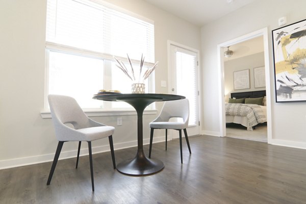 Dining area with elegant lighting and modern decor at The Ravelle at Ridgeview Apartments, luxury living with style and comfort