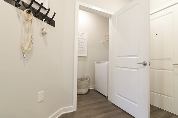 Hallway at The Ravelle: Elegant corridor with modern lighting and art in upscale Ridgeview Apartments