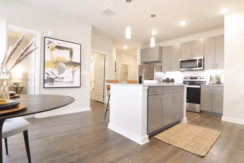 Modern kitchen with stainless steel appliances at The Ravelle at Ridgeview Apartments