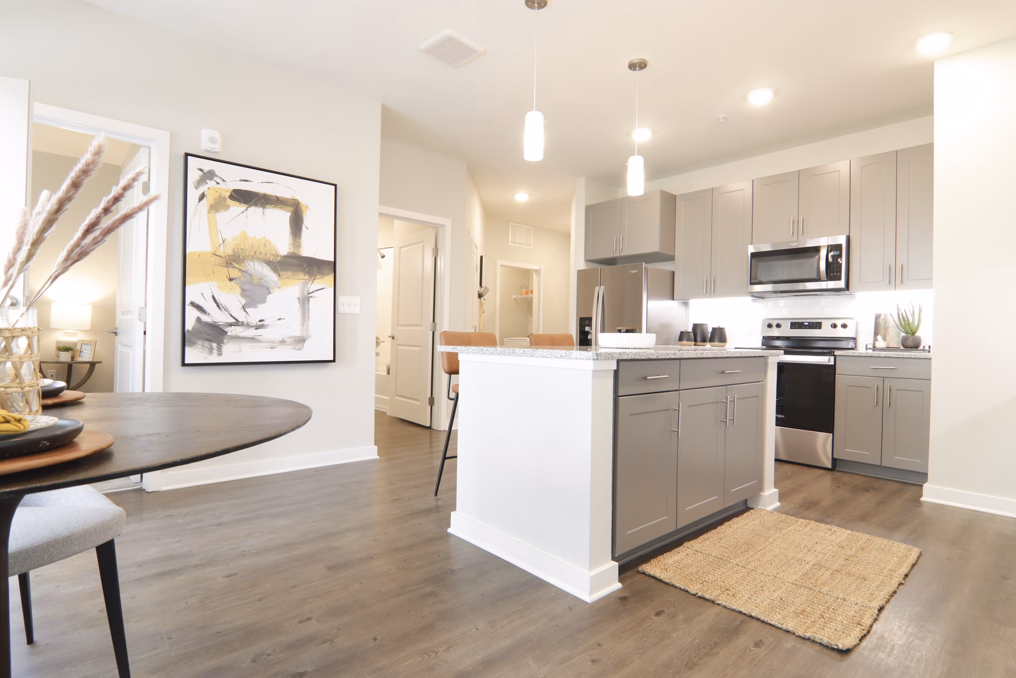Modern kitchen with stainless steel appliances at The Ravelle at Ridgeview Apartments