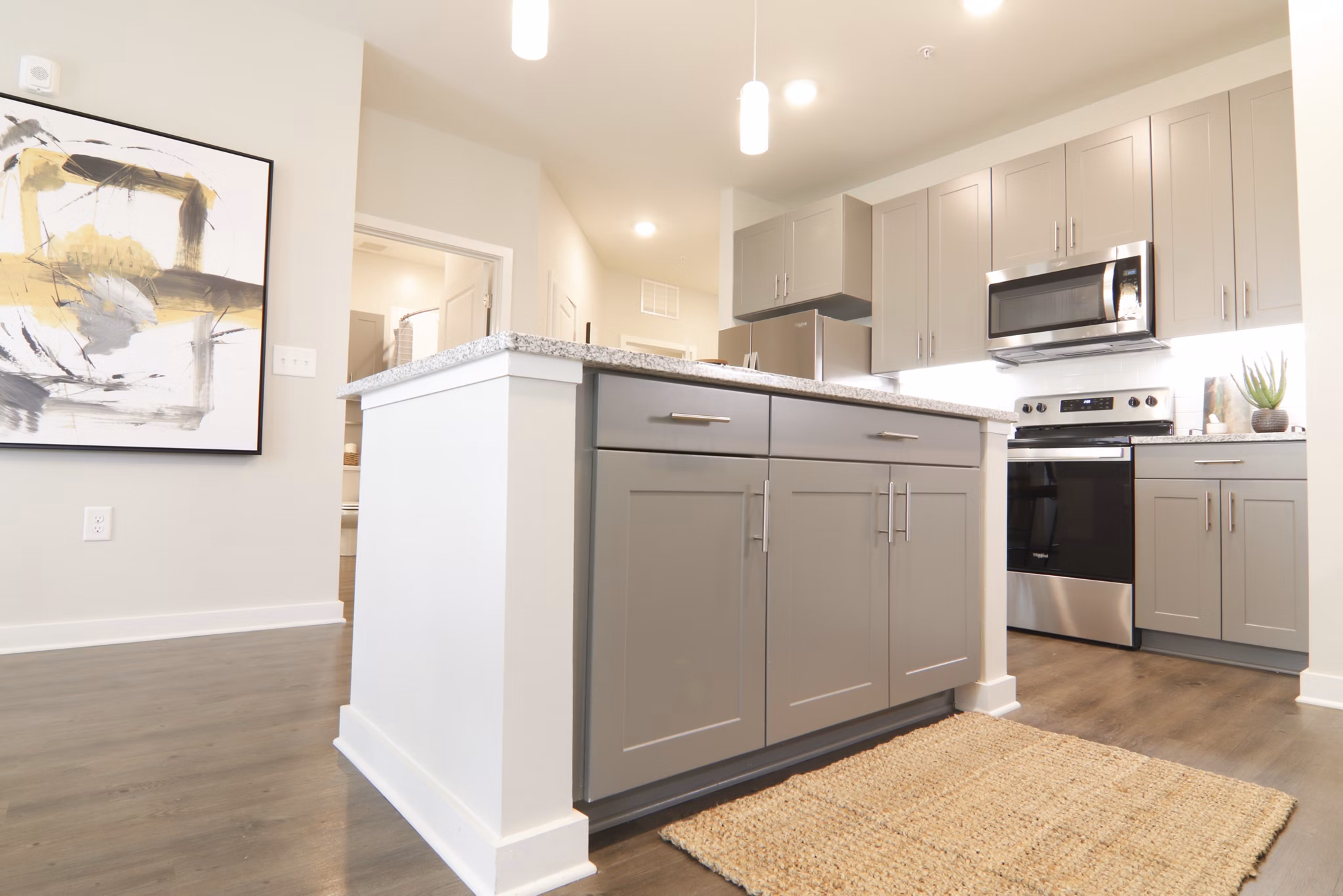 Modern kitchen with sleek cabinetry and stainless-steel appliances at The Ravelle at Ridgeview luxury apartments