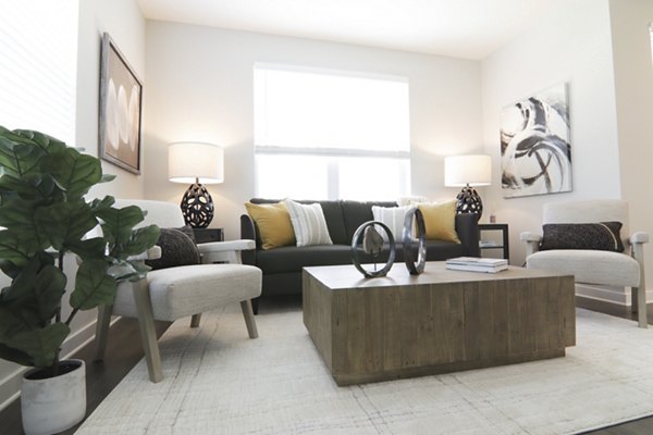 Modern living room with sleek furnishings at The Ravelle at Ridgeview Apartments