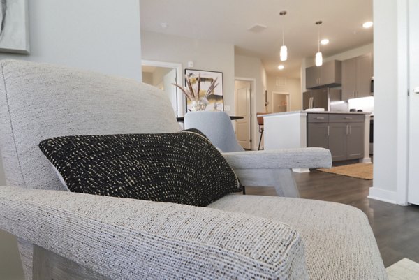 Spacious living room with modern decor in The Ravelle at Ridgeview Apartments