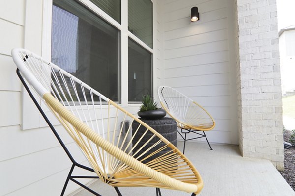 Patio with outdoor seating at The Ravelle at Ridgeview Apartments