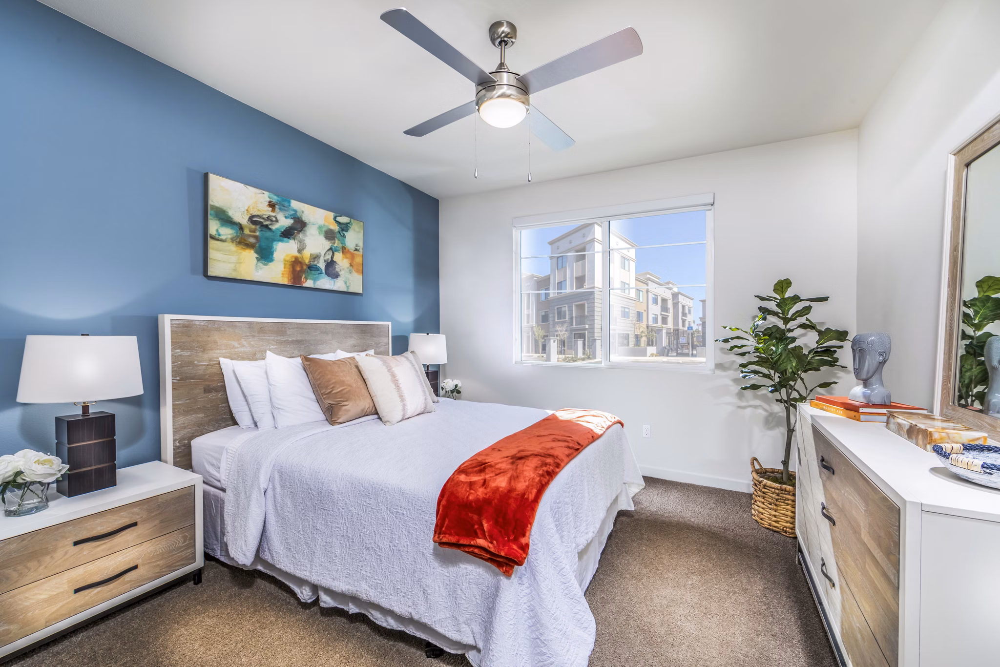 Cozy bedroom with modern design features at Alcove Apartments, luxury living experience in a stylish setting