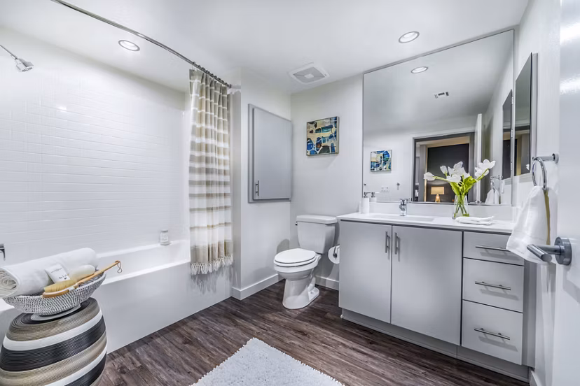 Alcove Apartments: Modern bathroom with sleek fixtures and elegant design