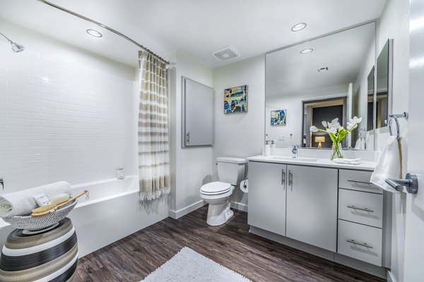 Alcove Apartments: Modern bathroom with sleek fixtures and elegant design