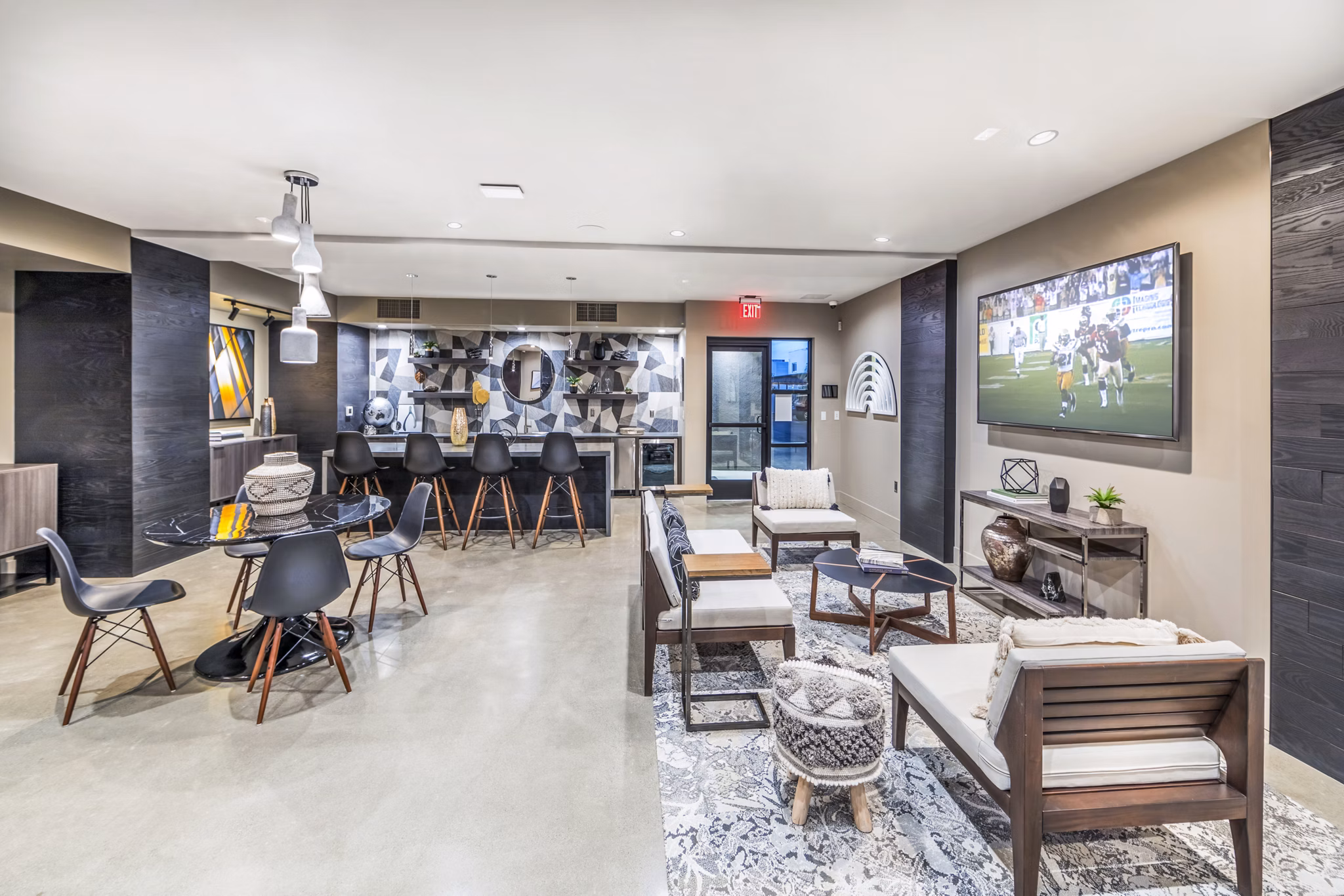 Modern clubhouse with stylish seating and fireplace at Alcove Apartments, a luxury Greystar community