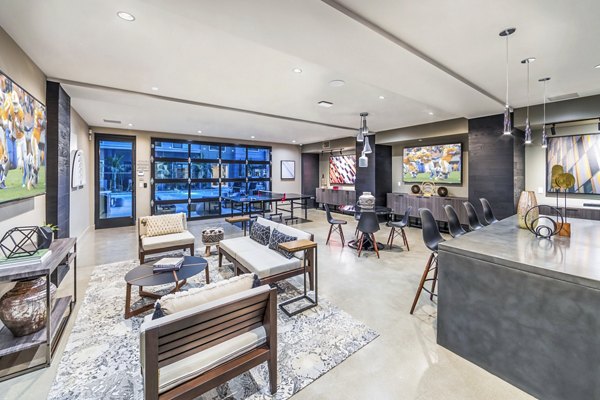 Contemporary clubhouse featuring spacious seating and modern decor at Alcove Apartments