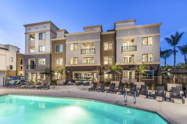 Heated outdoor pool at Alcove Apartments, perfect for relaxation and leisure in a luxurious setting