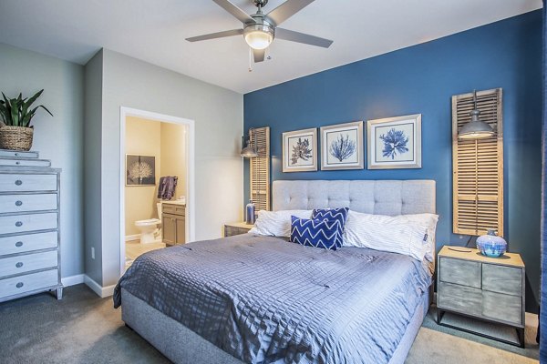 Modern bedroom with elegant decor at Everleigh Cool Springs Apartments