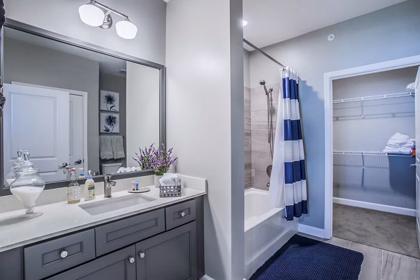 Contemporary bathroom with sleek fixtures in Everleigh Cool Springs Apartments