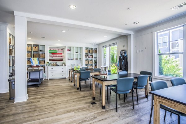Creative arts and crafts area at Everleigh Cool Springs Apartments featuring ample workspace and vibrant supplies for residents