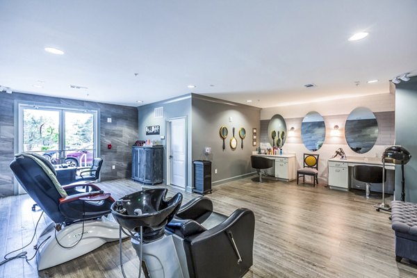Chic clubhouse salon featuring modern seating and decor at Everleigh Cool Springs Apartments