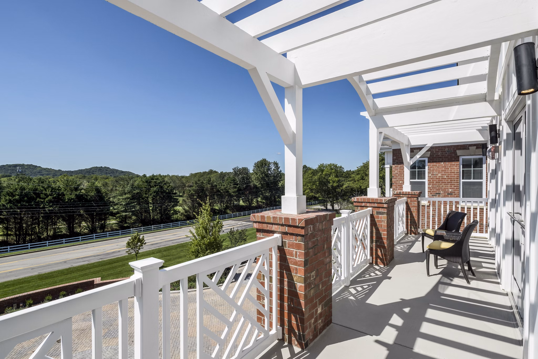 Modern outdoor lounge on clubhouse patio at Everleigh Cool Springs Apartments