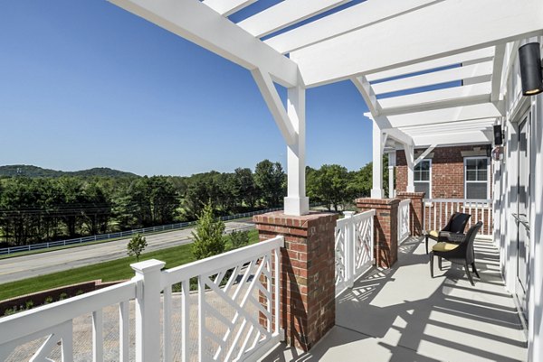 Modern outdoor lounge on clubhouse patio at Everleigh Cool Springs Apartments