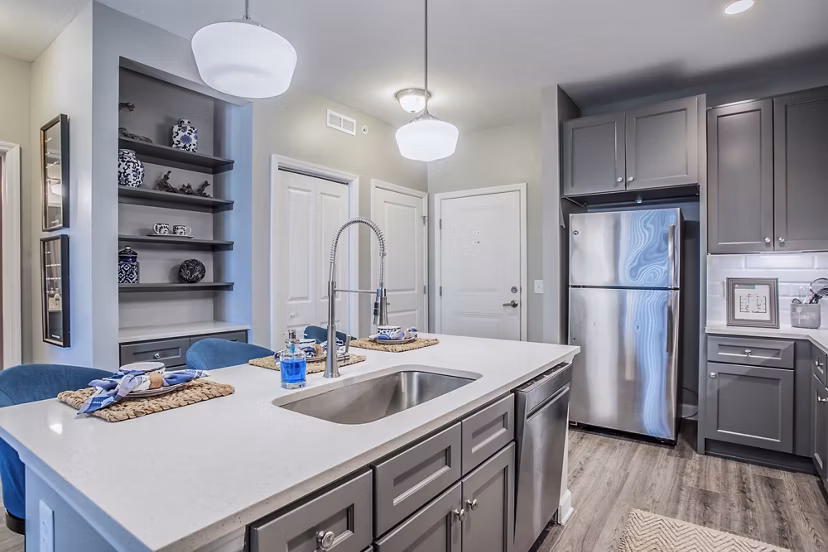 Modern kitchen with stainless steel appliances at Everleigh Cool Springs Apartments