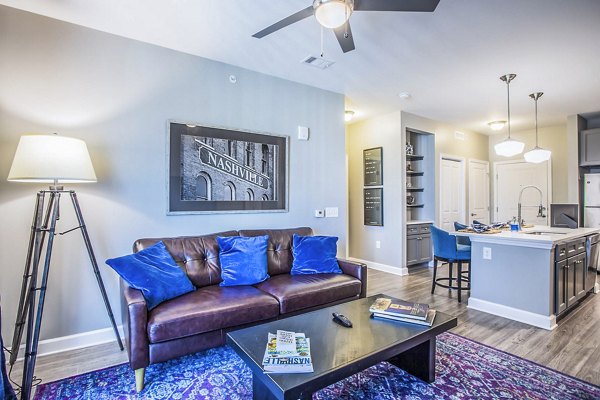Cozy living room with modern furnishings at Everleigh Cool Springs Apartments
