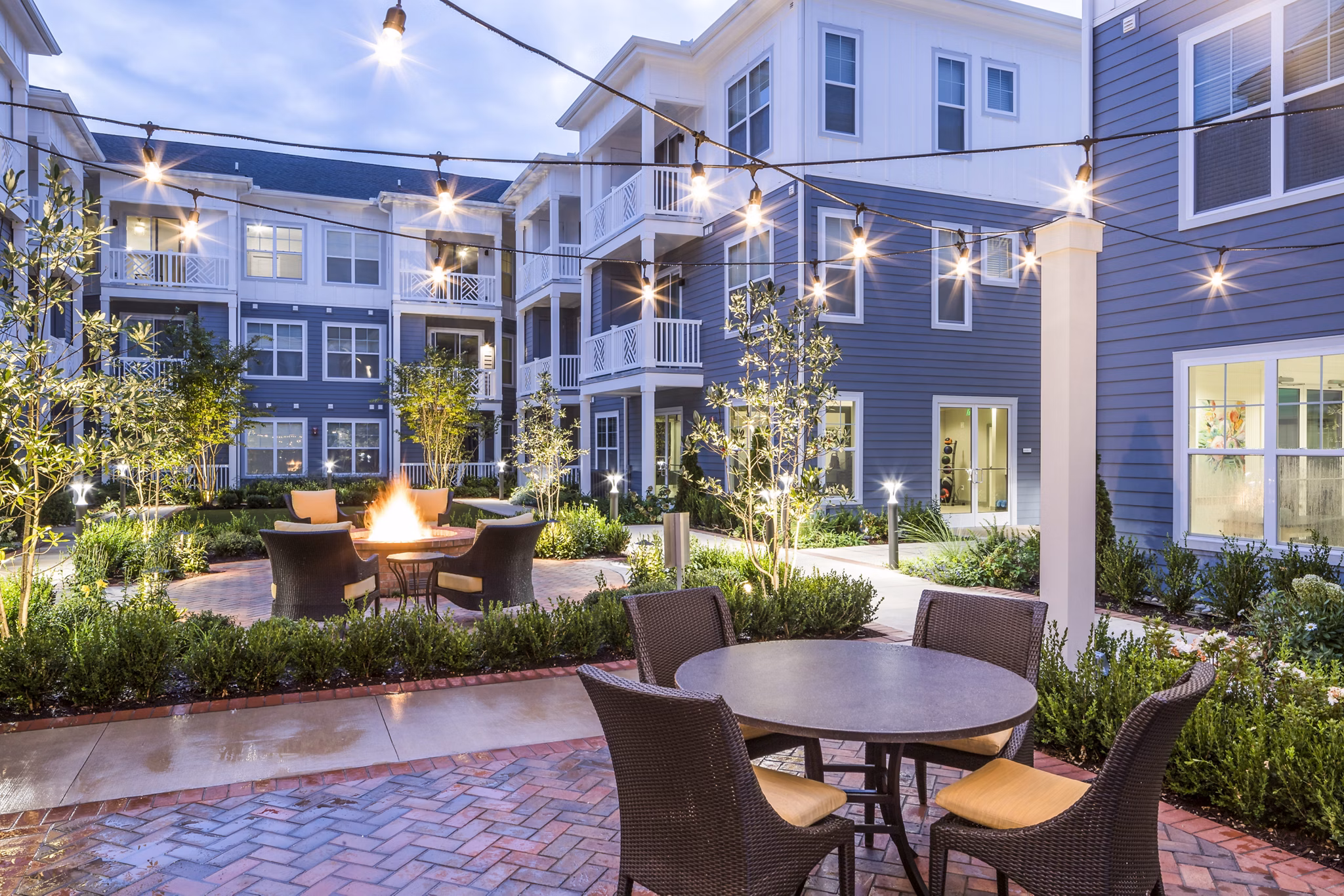Cozy fire pit on a scenic patio at Everleigh Cool Springs Apartments