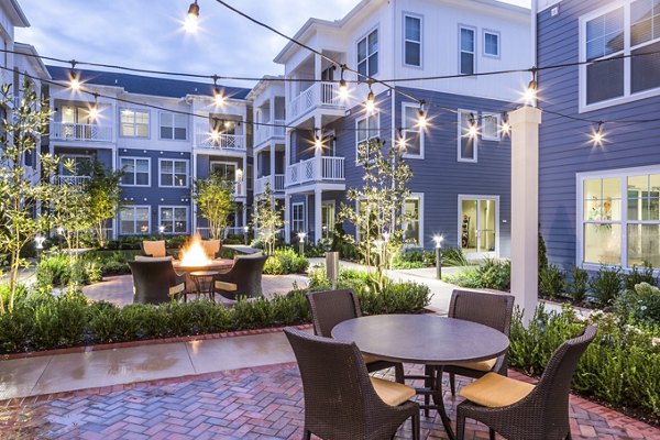 Cozy fire pit on a scenic patio at Everleigh Cool Springs Apartments
