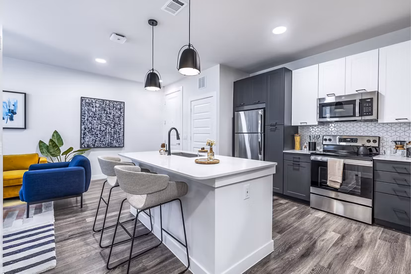Modern kitchen with stainless steel appliances in Perch Apartments