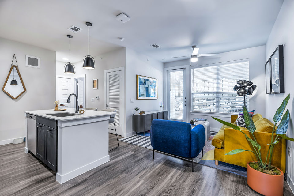 Modern living room with minimalist design at Perch Apartments, featuring stylish decor and comfortable seating