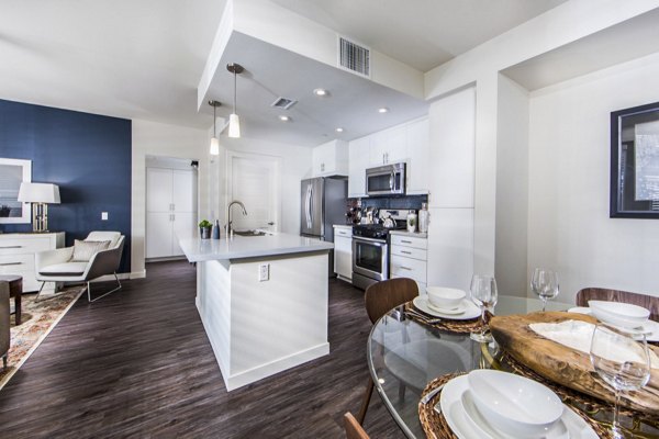 Modern kitchen with stainless steel appliances at Haven76 Apartments
