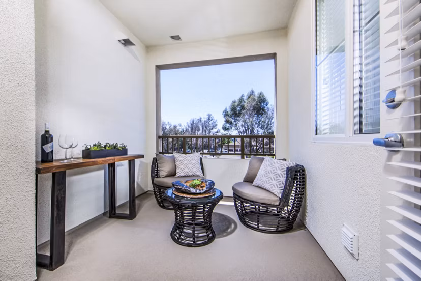 Haven76 Apartments: Chic patio with modern furnishings and lush landscaping