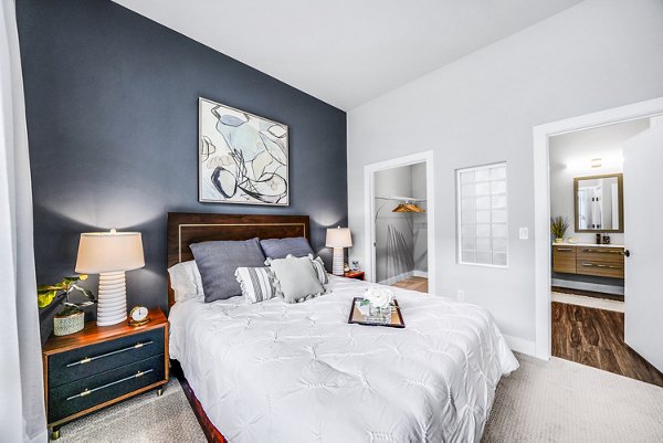 Modern bedroom with elegant decor at Beckon Collective Apartments Luxurious setup designed for comfort and style