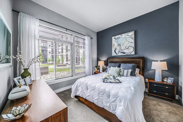 Modern bedroom featuring chic design and spacious layout at Beckon Collective Apartments