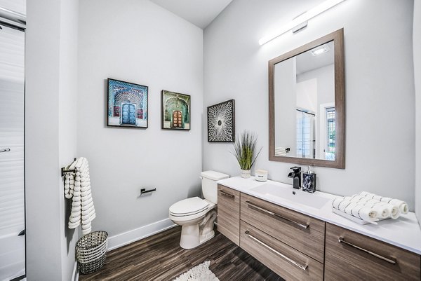 Modern bathroom featuring sleek fixtures in Beckon Collective Apartments, luxury living by Greystar