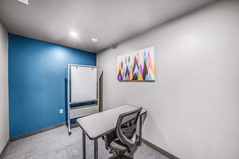 Business center with collaborative workspaces at Beckon Collective Apartments