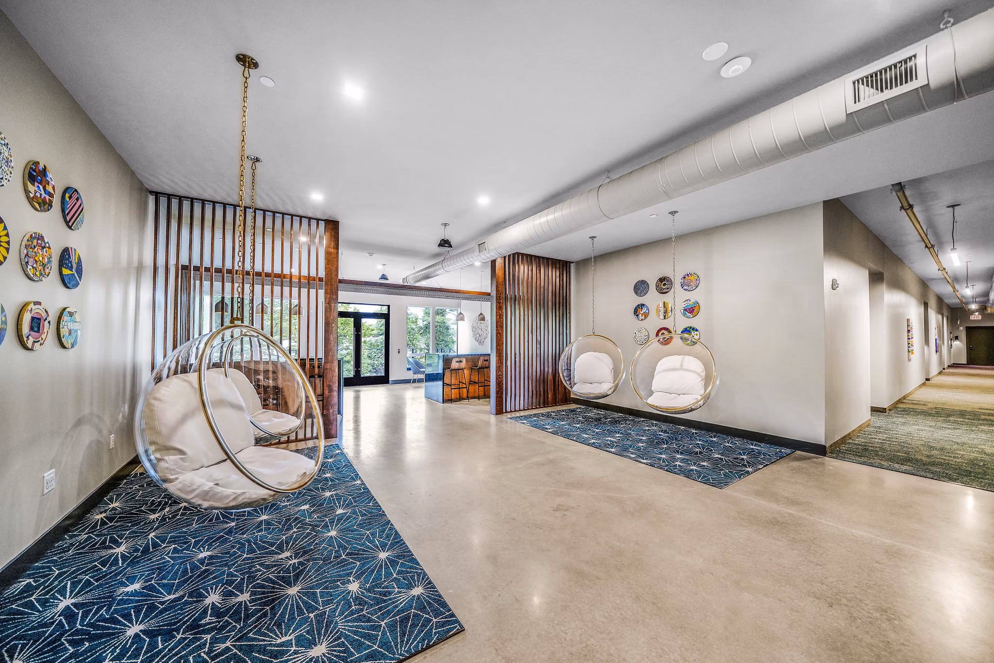 Clubhouse lobby with modern seating and dÃ©cor at Beckon Collective Apartments