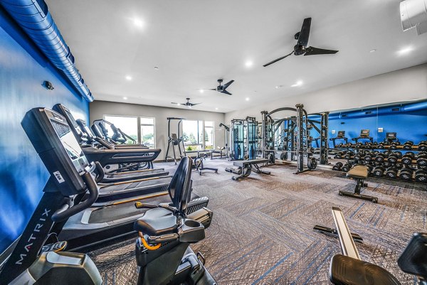 fitness center at Beckon Collective Apartments