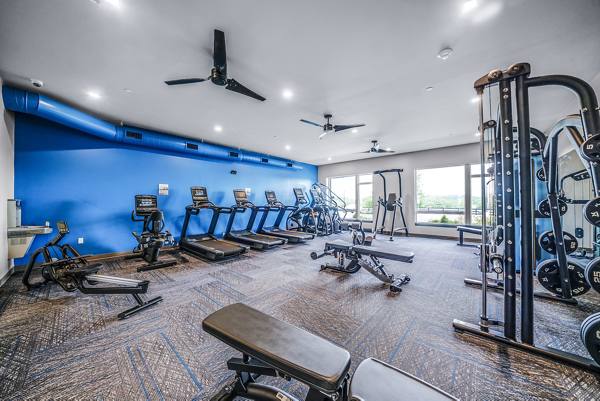 fitness center at Beckon Collective Apartments